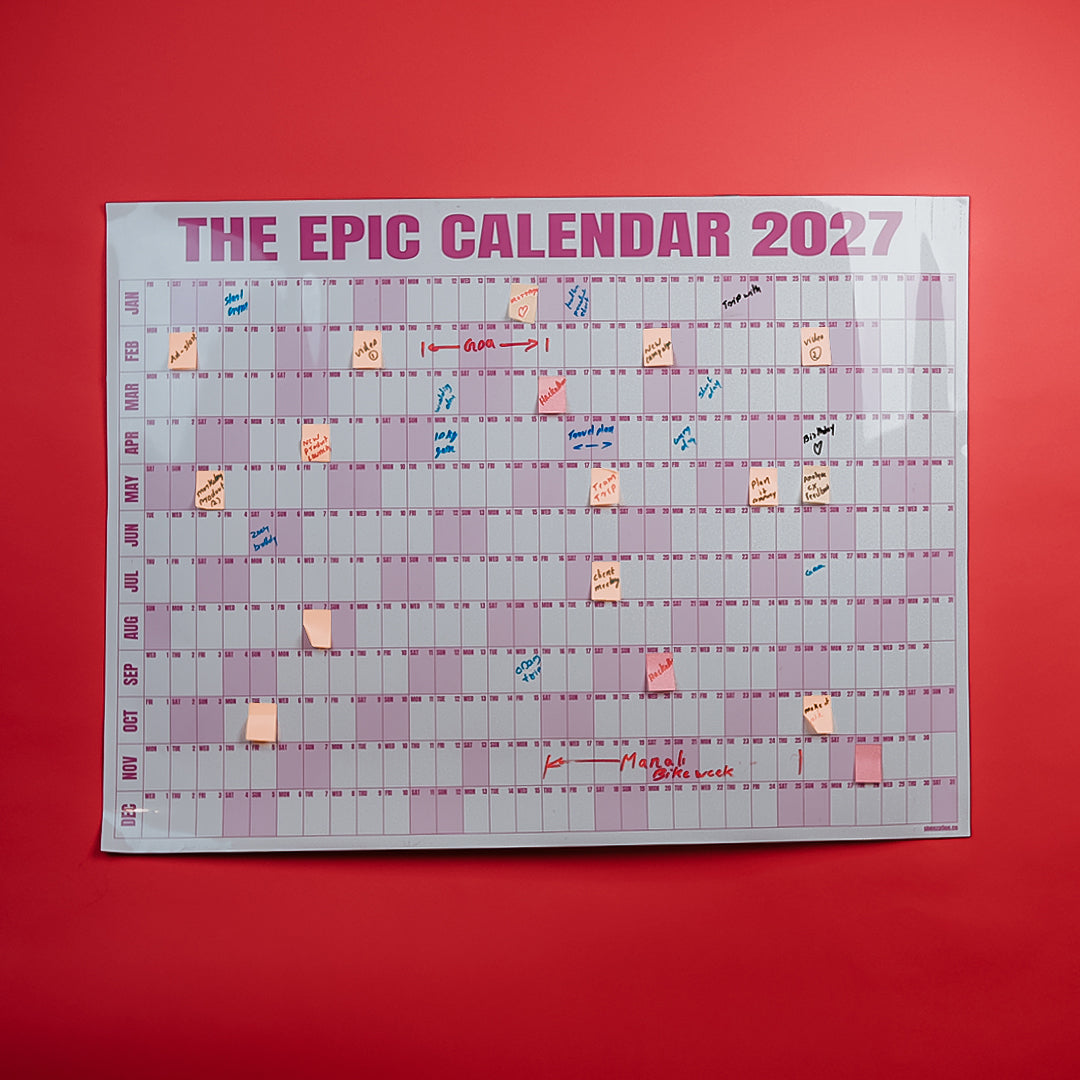Rose EPIC Calendar 2027 with notes on a red wall