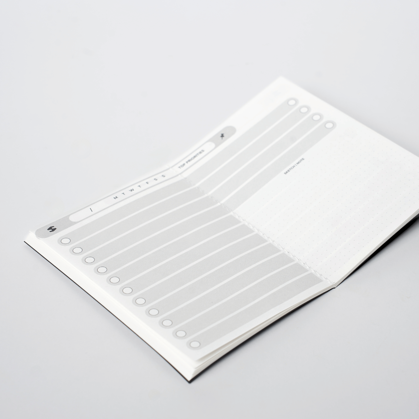Day Master | Undated Daily Planner with Monthly Stickers
