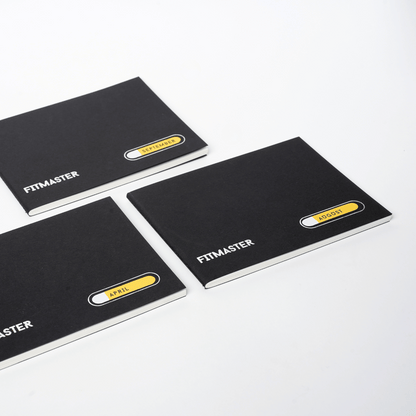 Three Fitmaster notebooks with month labels