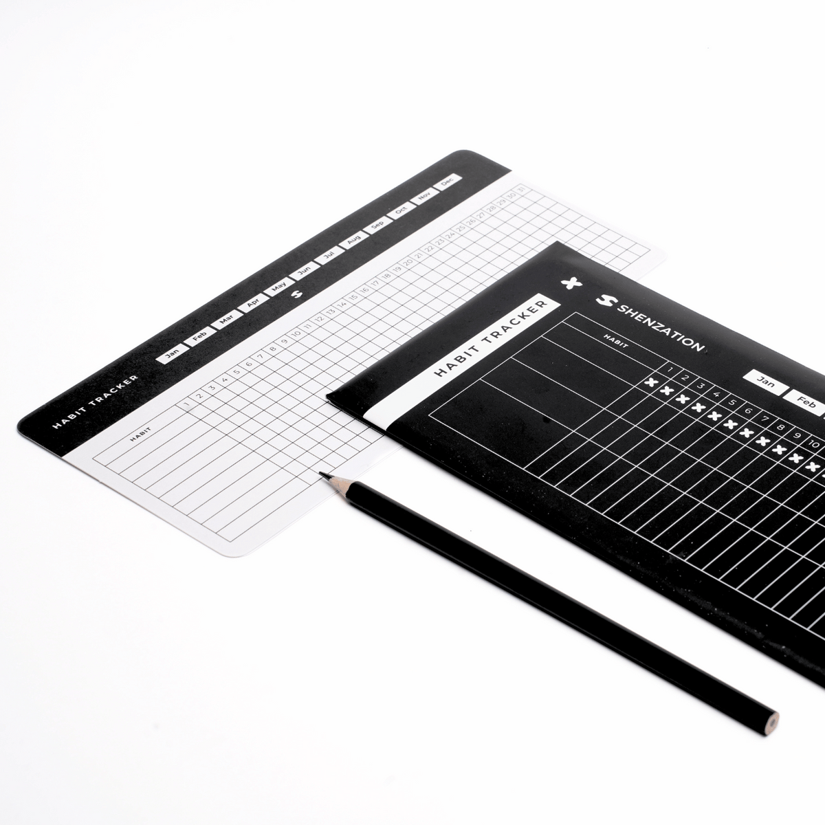 Black and white Habit Tracker Cards arranged with a pencil