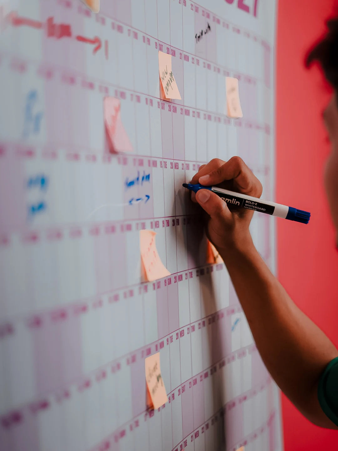 Original close-up photograph of a dry-erase marker writing on the Rose EPIC Calendar
