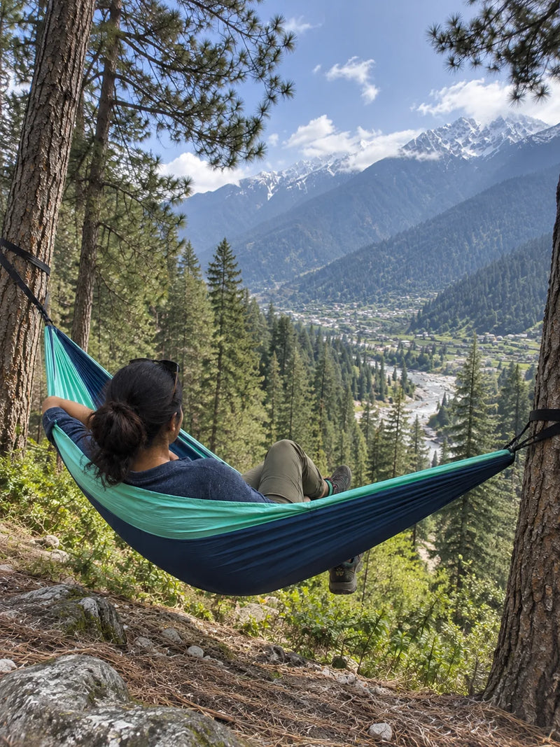 Young Indian woman resting in a hammock in the mountains