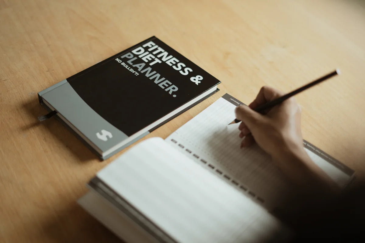 Open Fitness and Diet Planner showing workout and meal planning pages